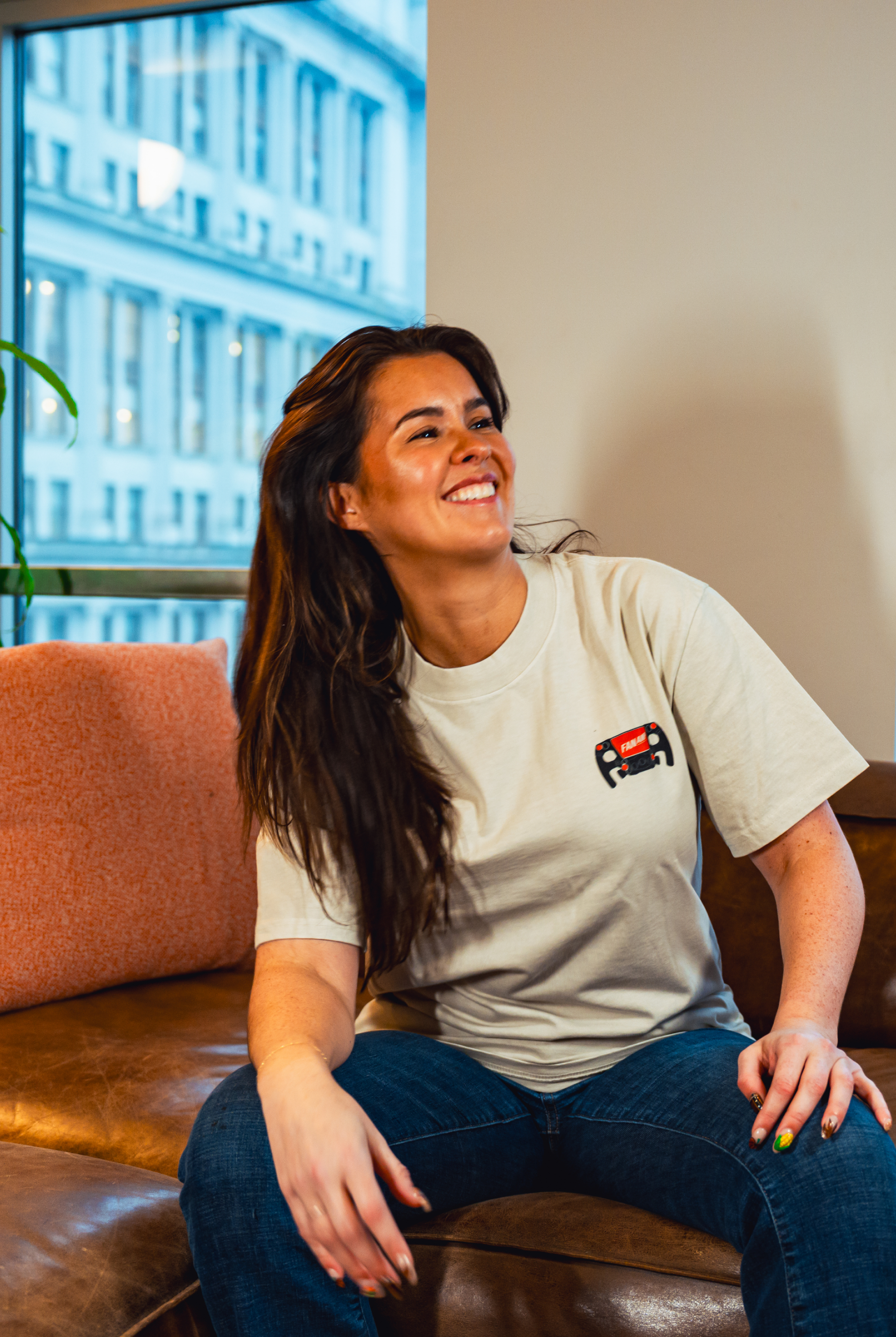Model in NYC office showing the front of the Faded Bone Make The Pass t-shirt