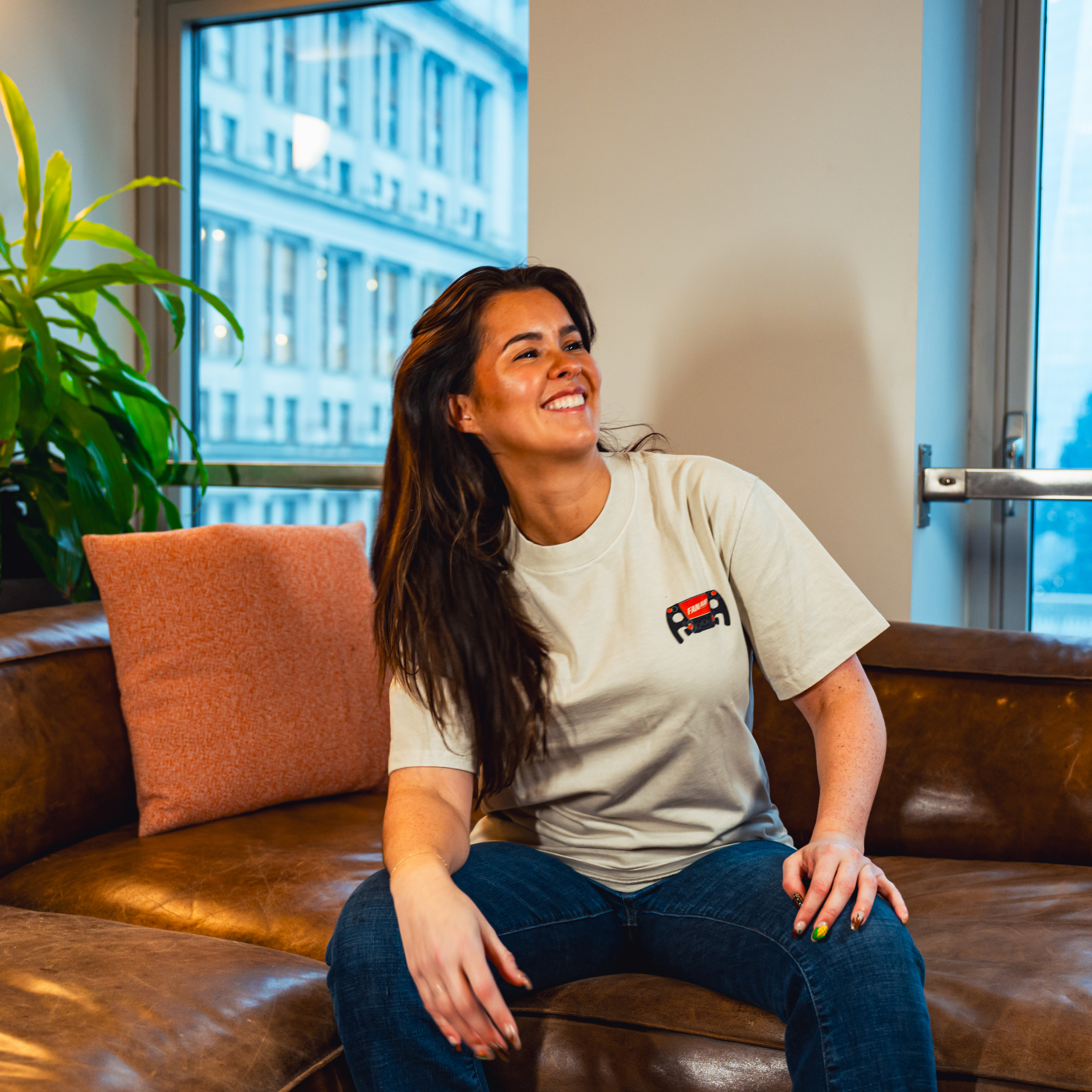 Model in NYC office showing the front of the Faded Bone Make The Pass t-shirt