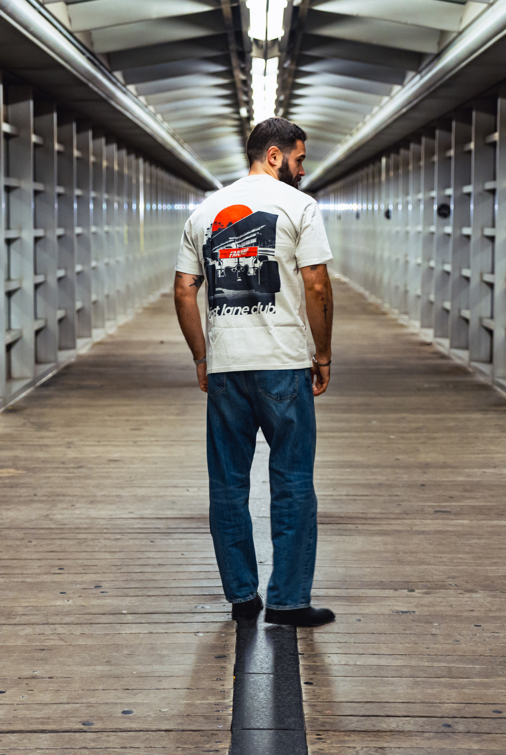 Model in NYC showing the back of the Faded Bone Make The Pass t-shirt