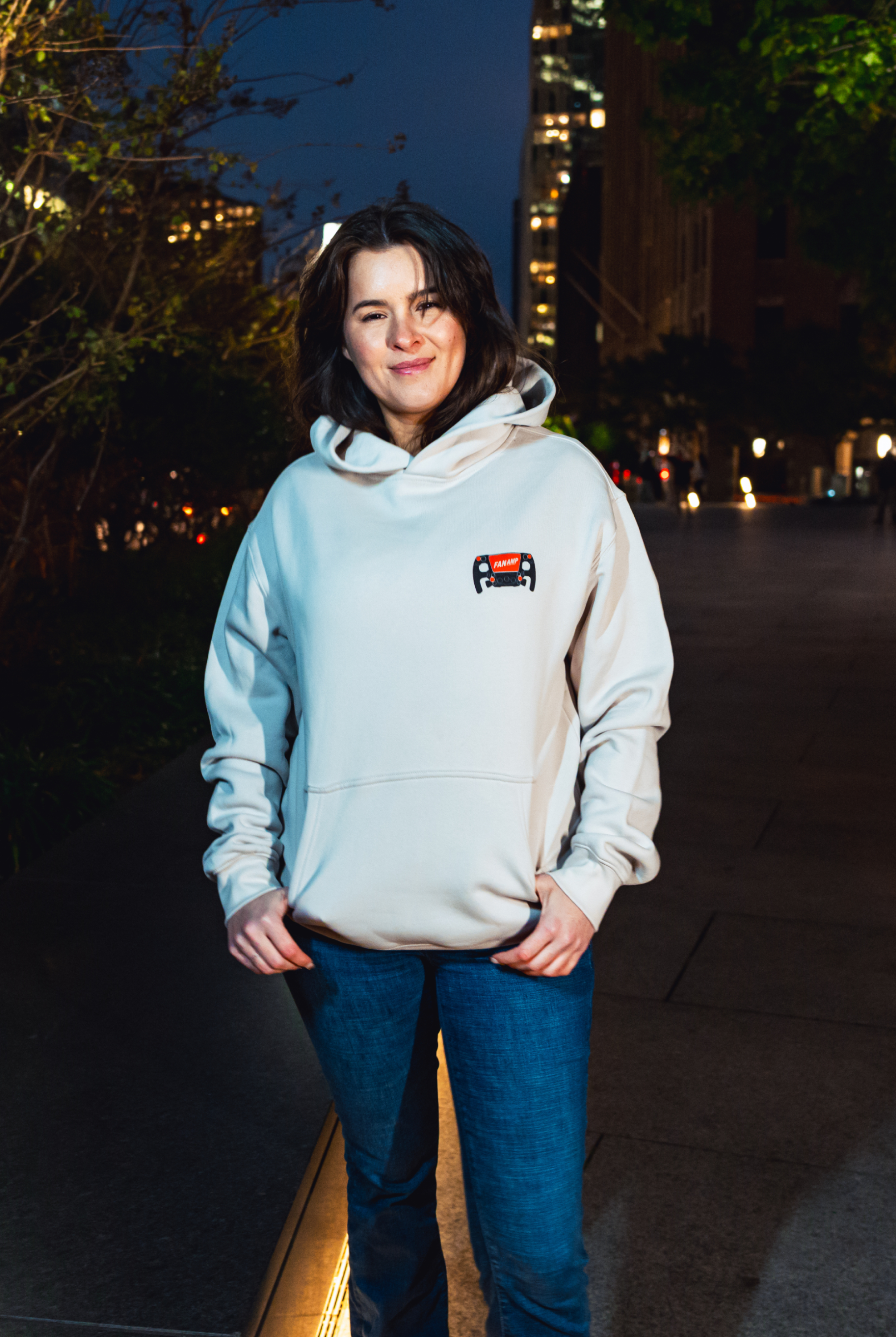 Model in NYC showing the front of the Bone Make The Pass hoodie