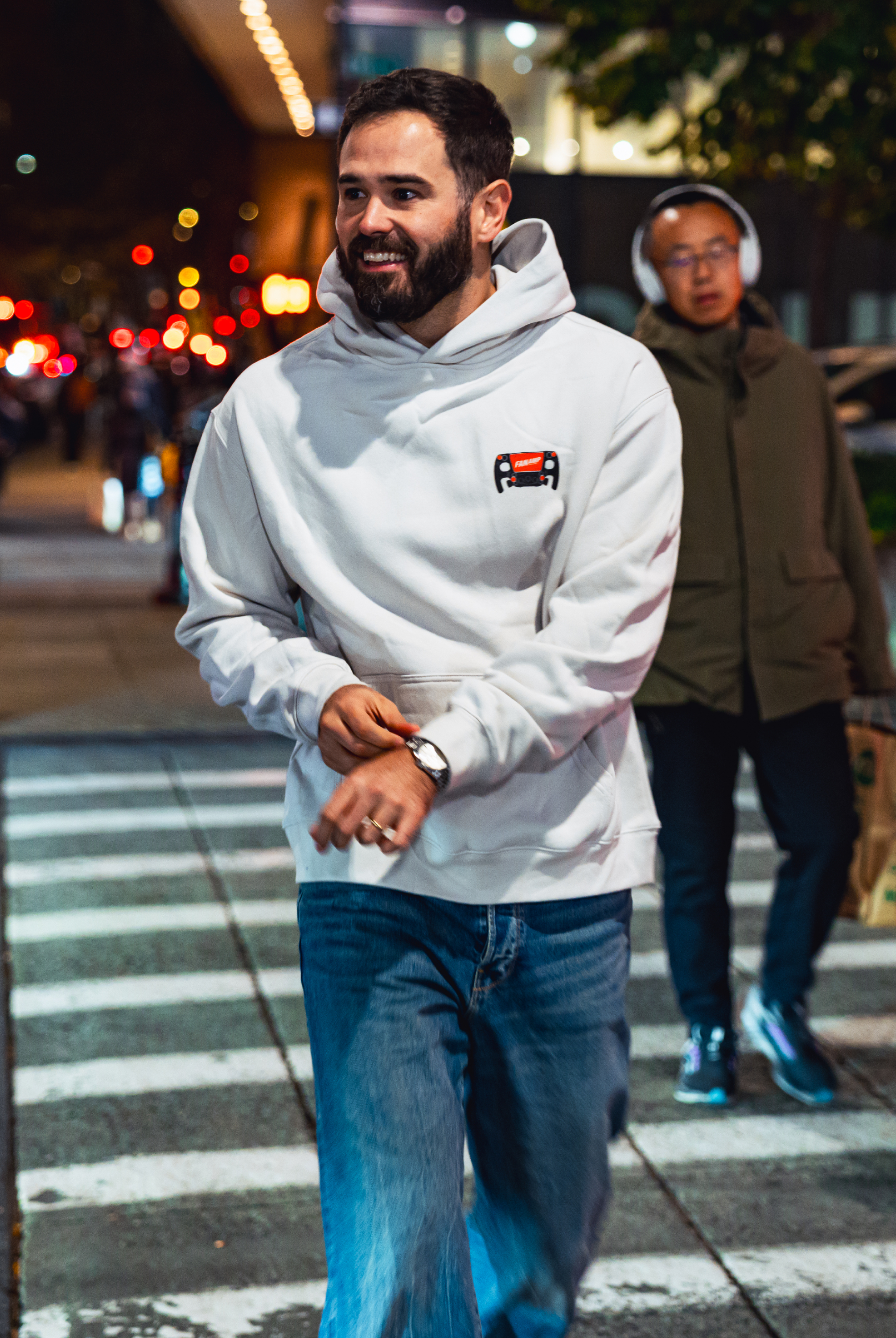 Model in NYC showing the front of the Bone Make The Pass hoodie