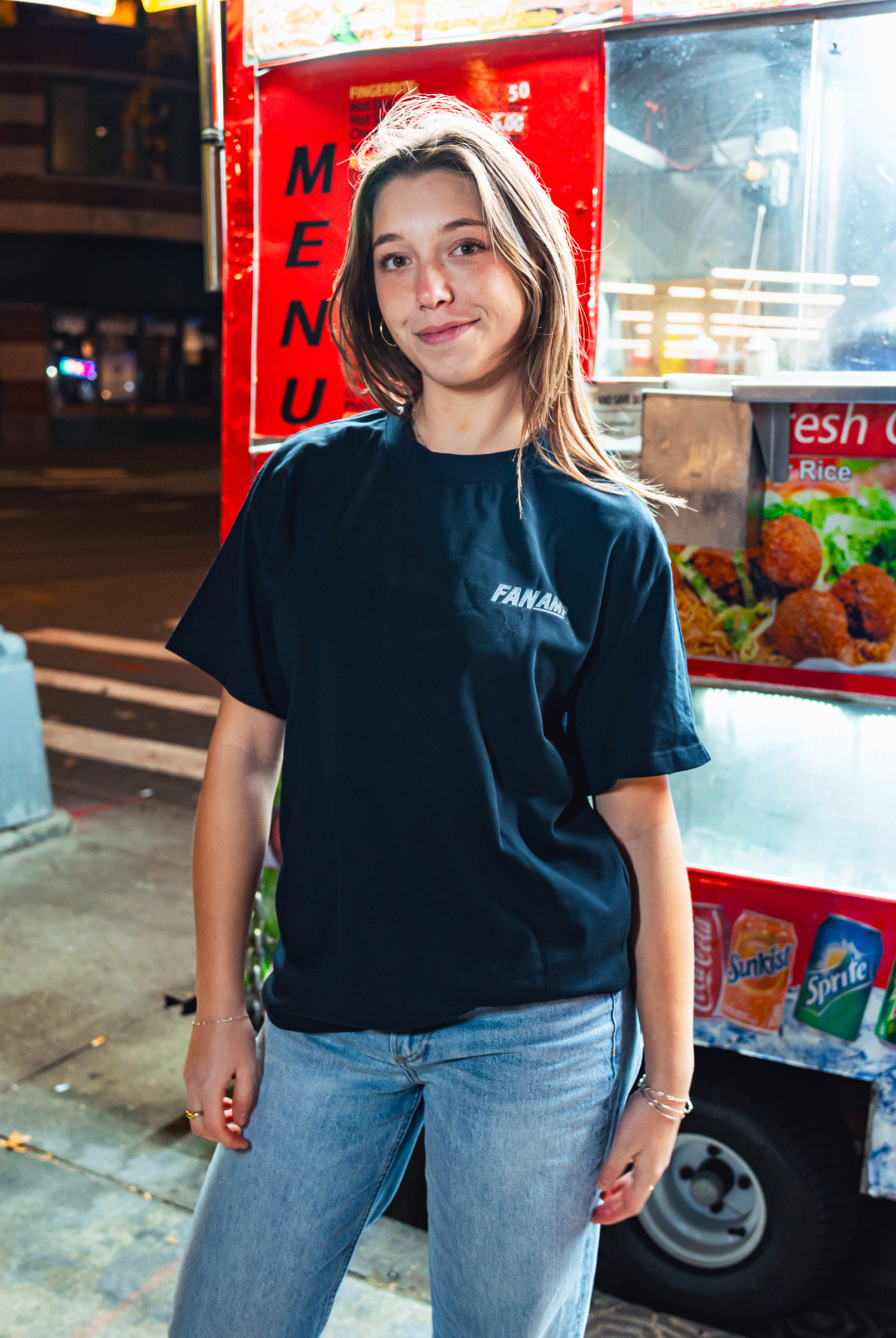 Model in NYC showing the front of the navy Safety First t-shirt