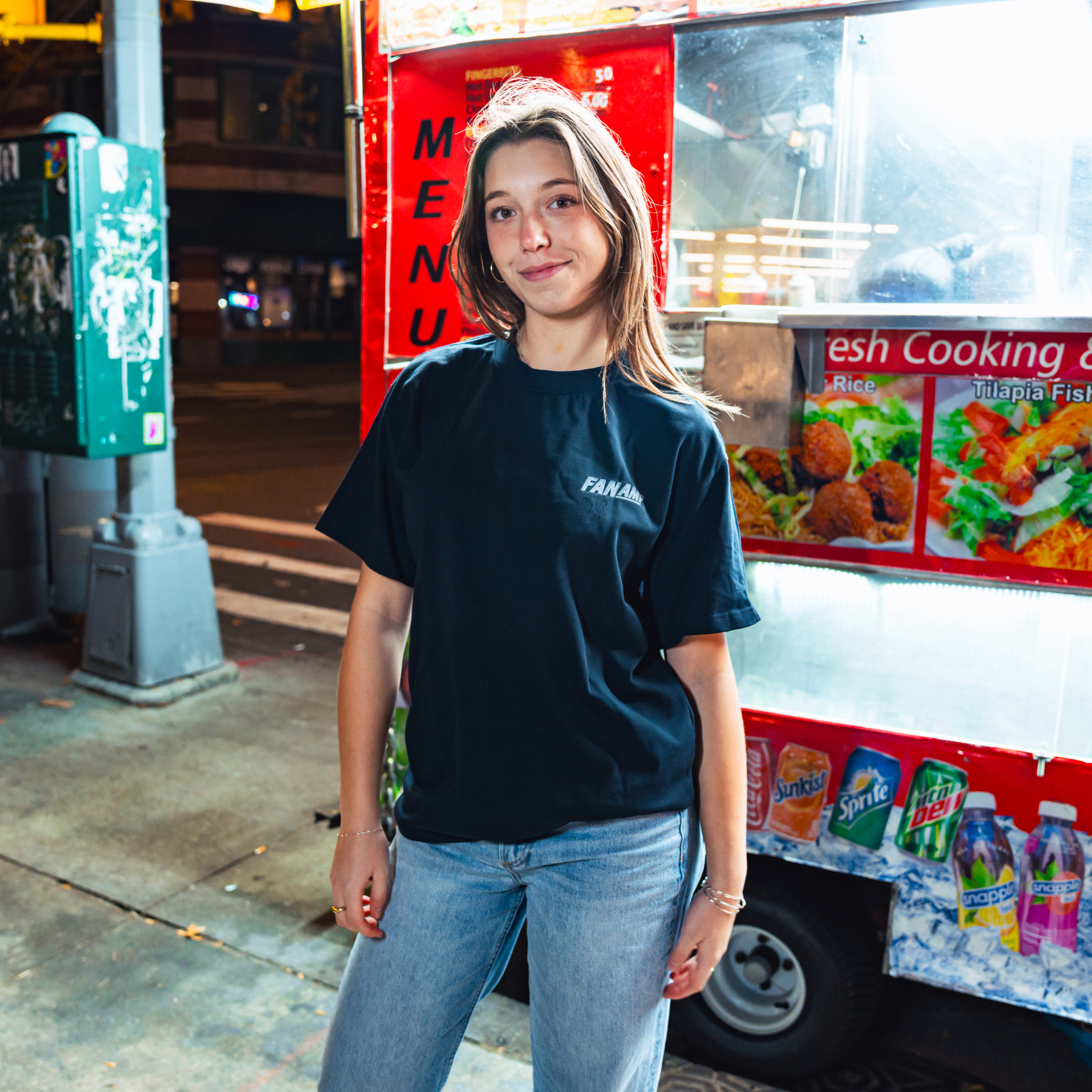 Model in NYC showing the front of the navy Safety First t-shirt