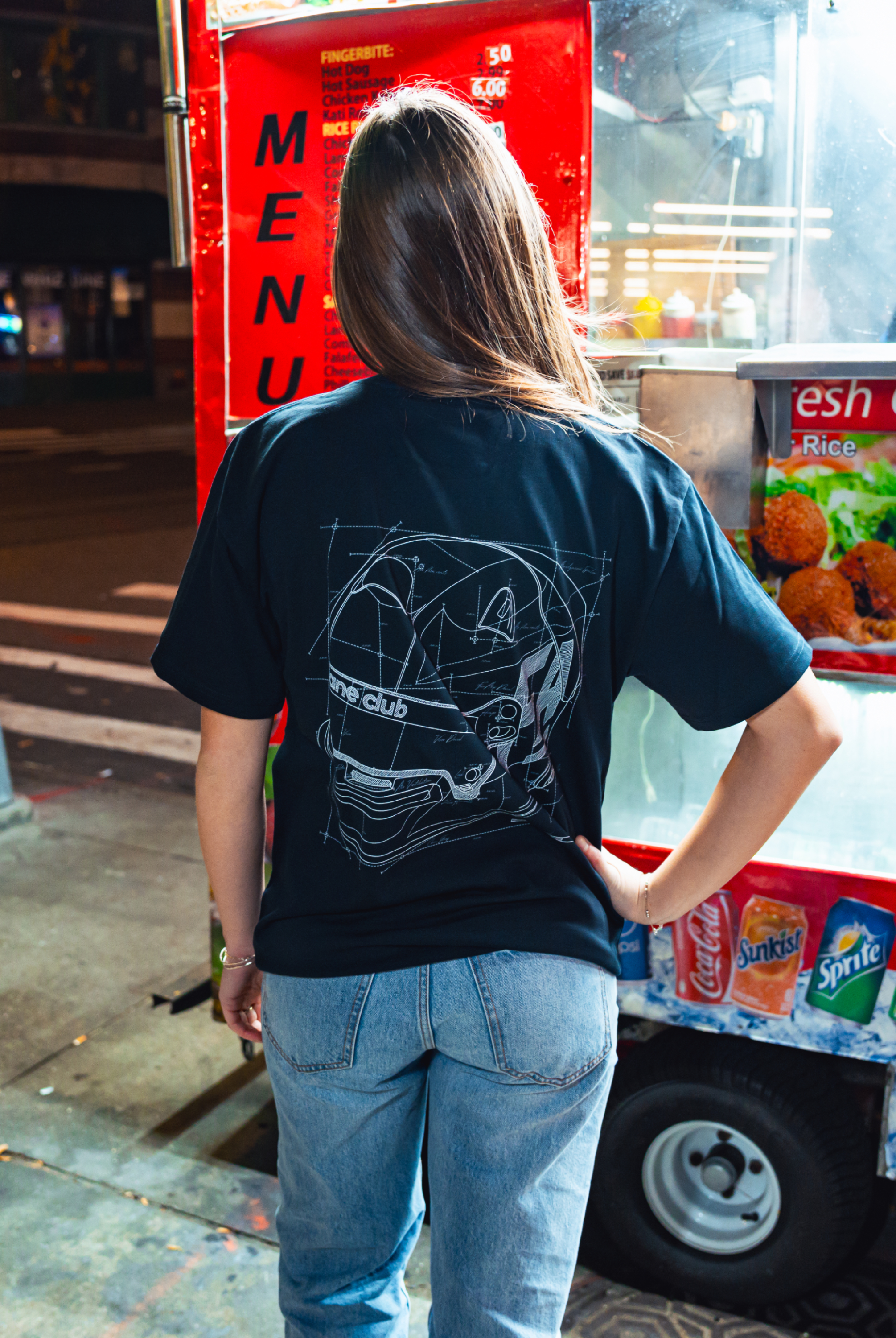Model in NYC showing the back of the navy Safety First t-shirt