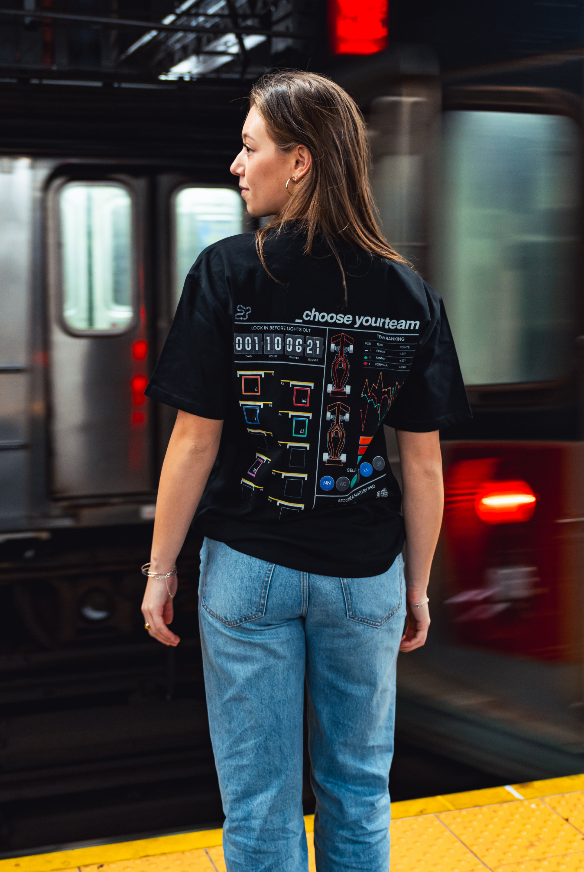 Model in NYC subway showing the back of the Black Fantasy Strategist t-shirt