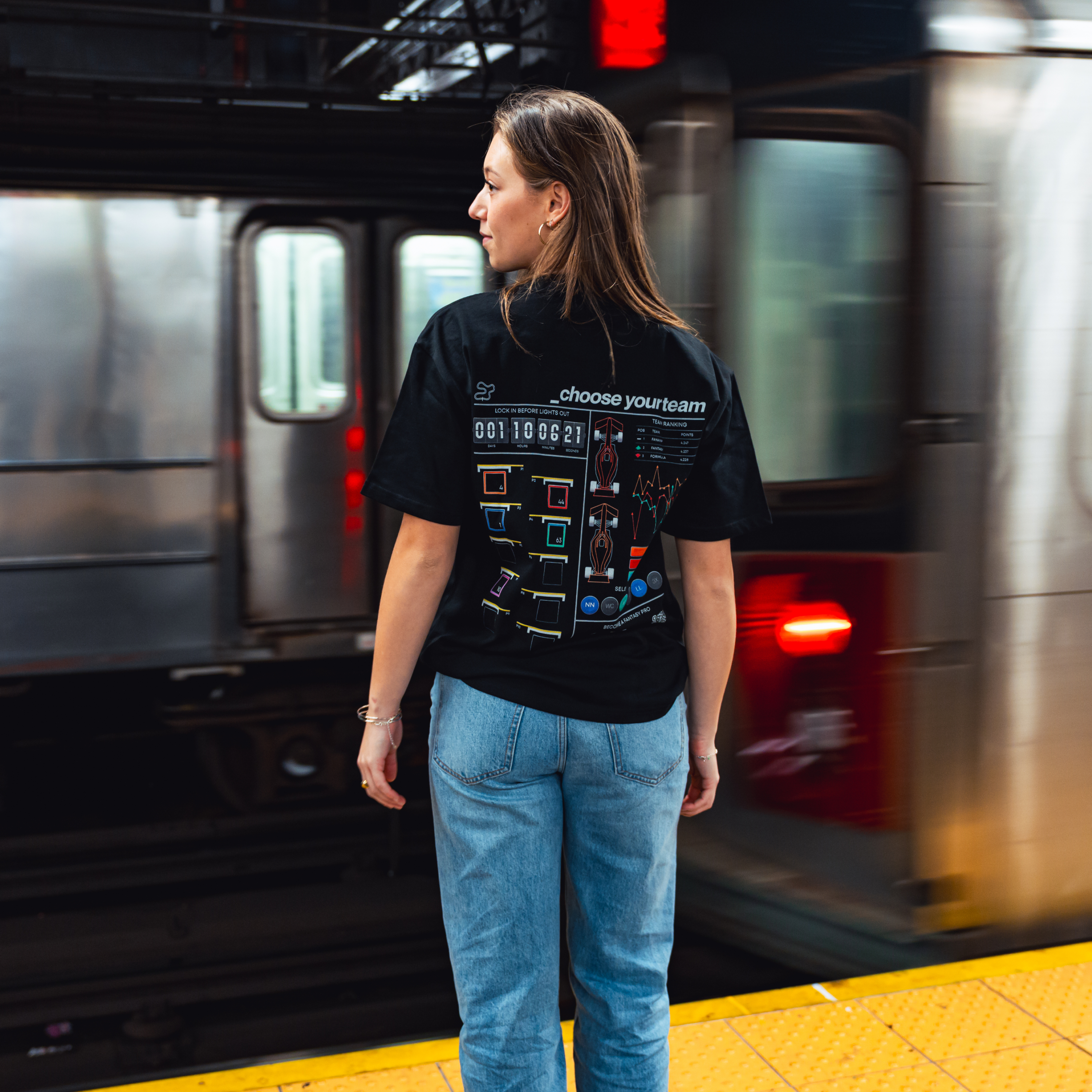 Model in NYC subway showing the back of the Black Fantasy Strategist t-shirt