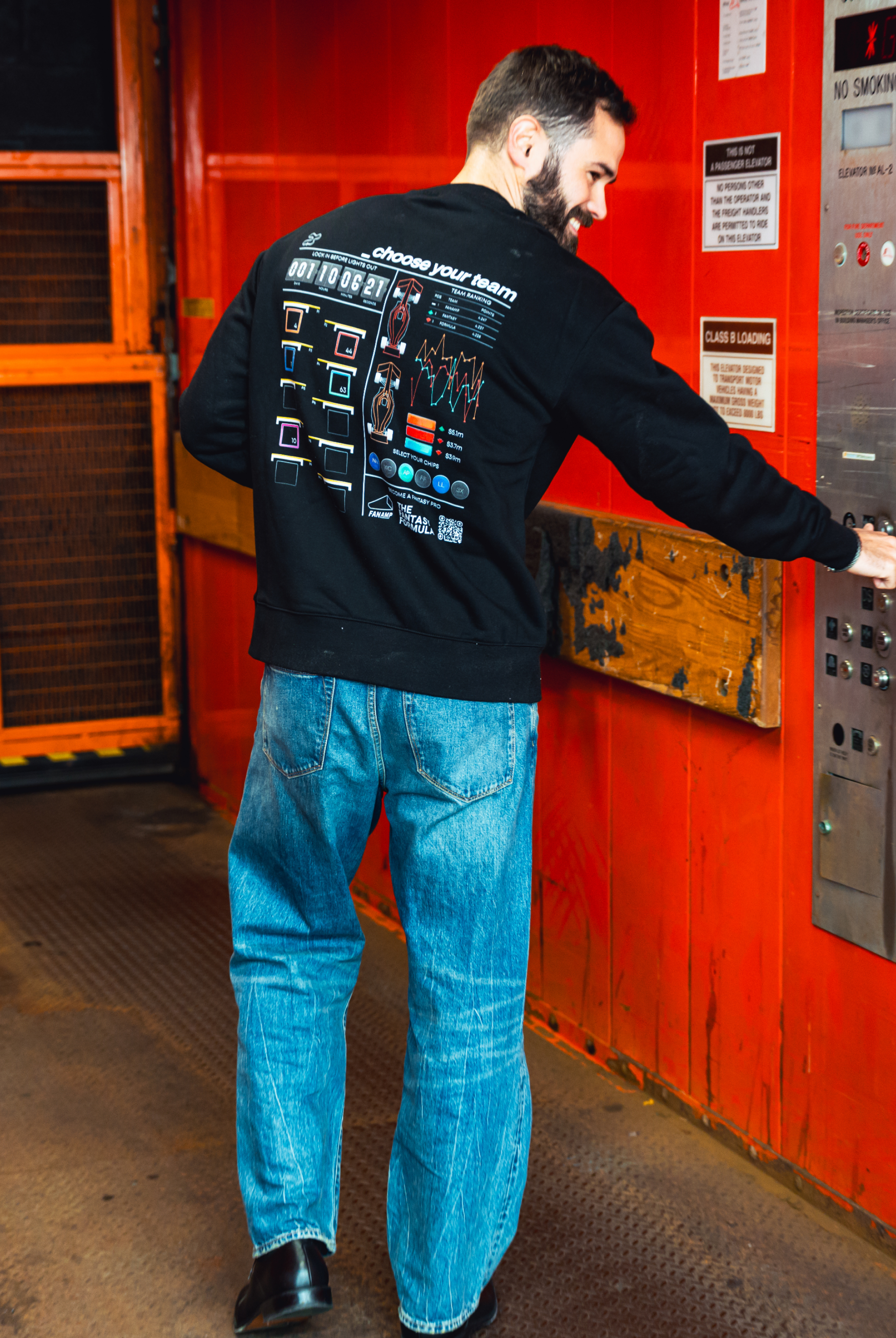 Model in NYC showing the back of the black Fantasy Strategist crewneck