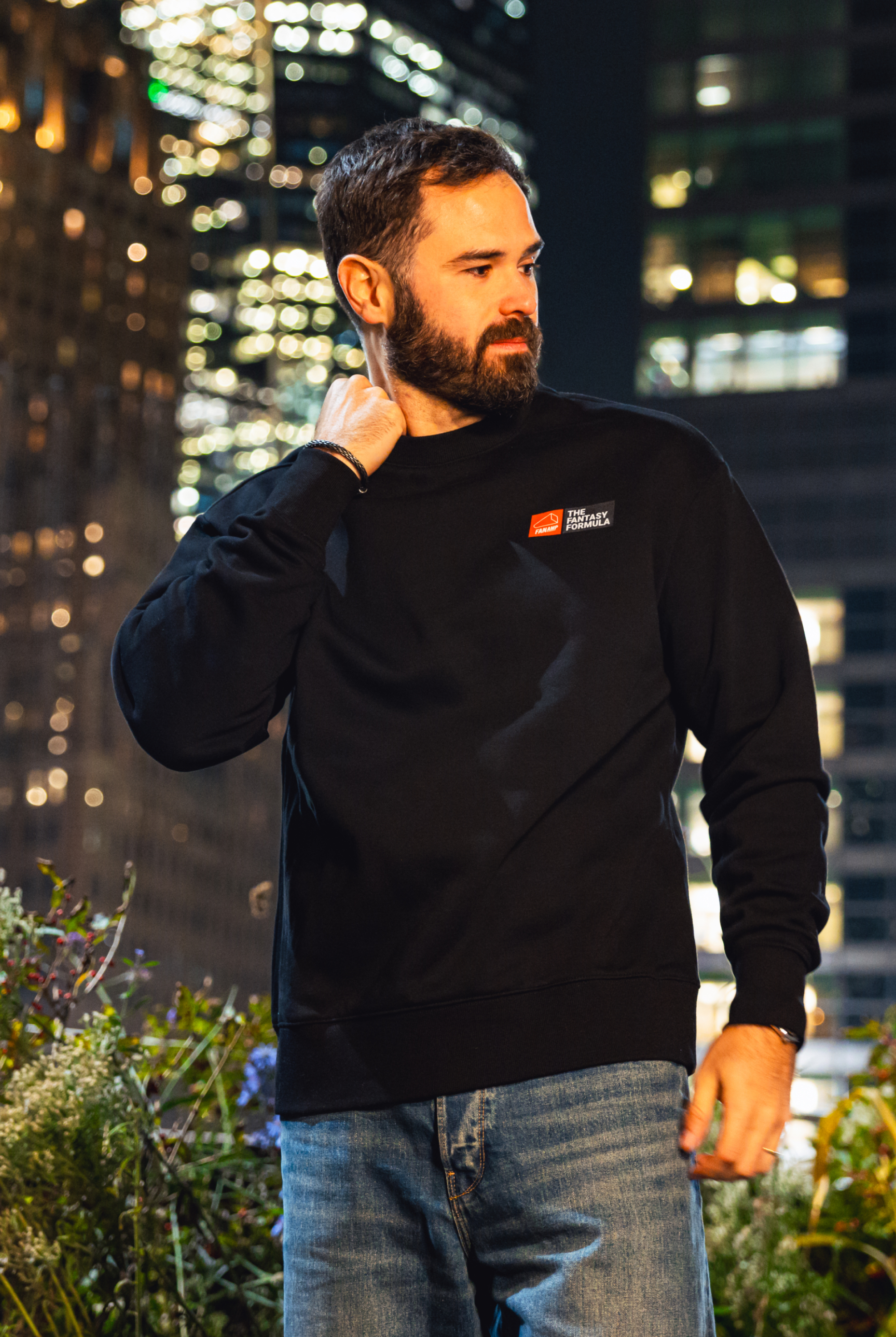 Model in NYC showing the front of the black Fantasy Strategist crewneck