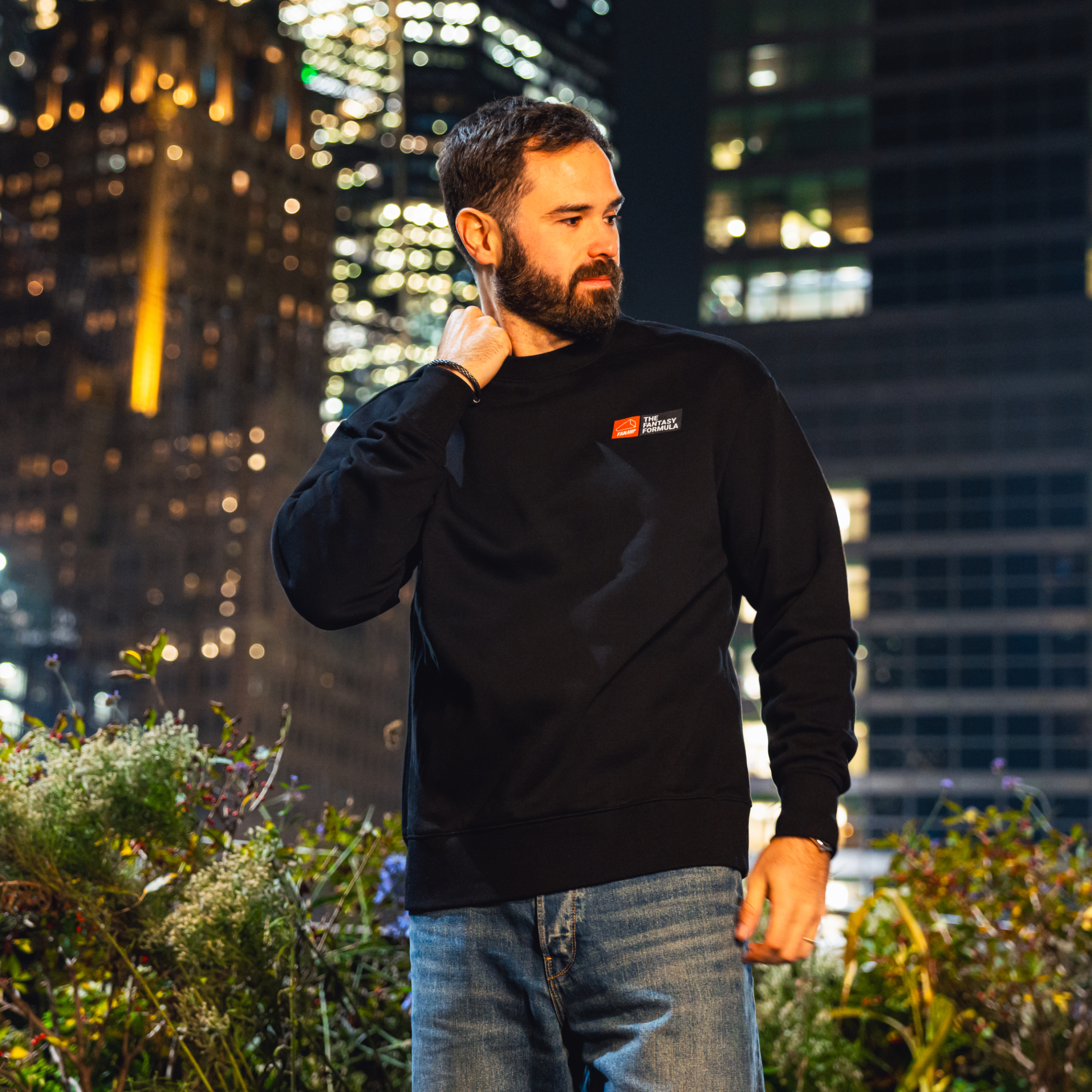 Model in NYC showing the front of the black Fantasy Strategist crewneck