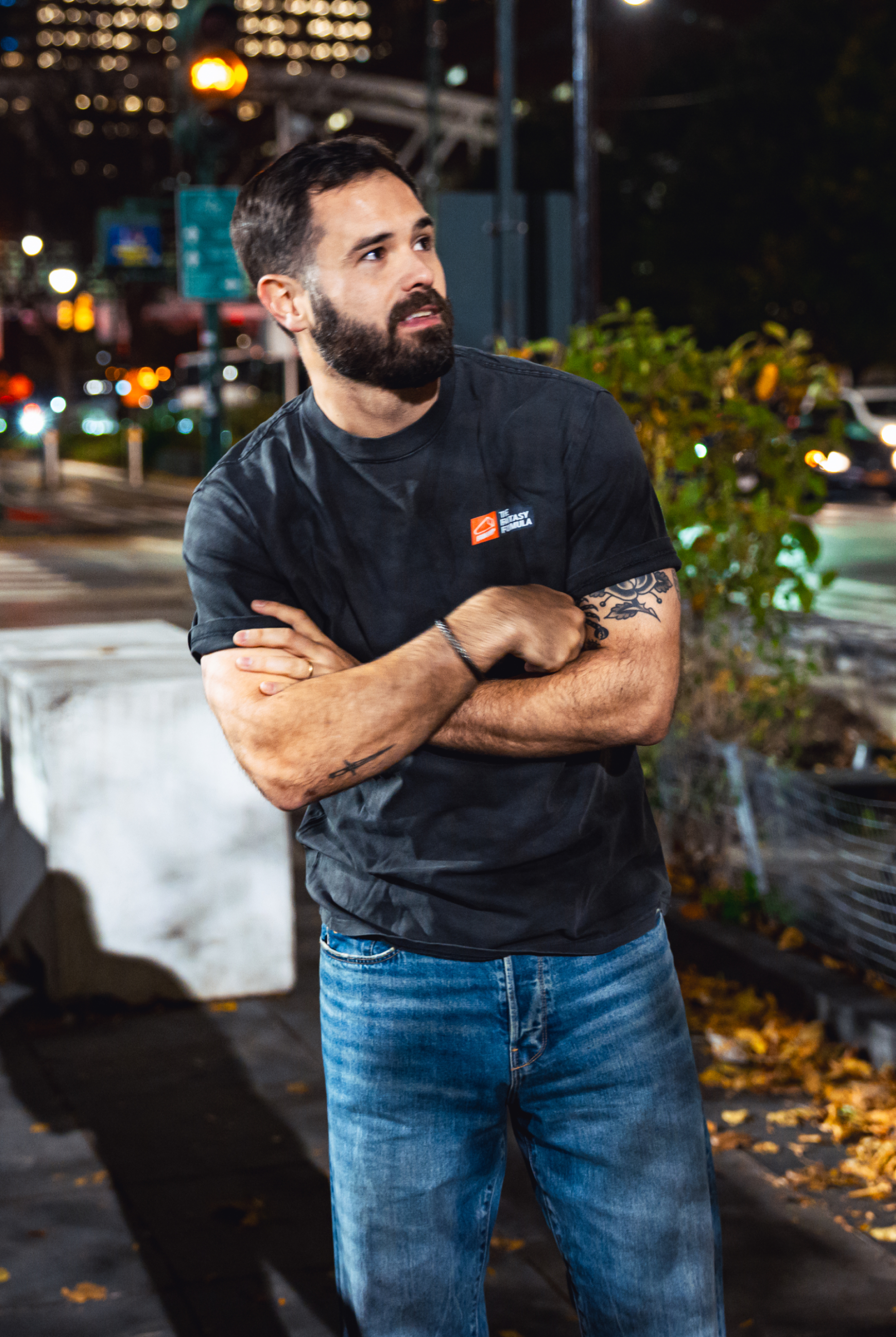 Model in NYC showing the front of the Faded Coal Fantasy Strategist t-shirt