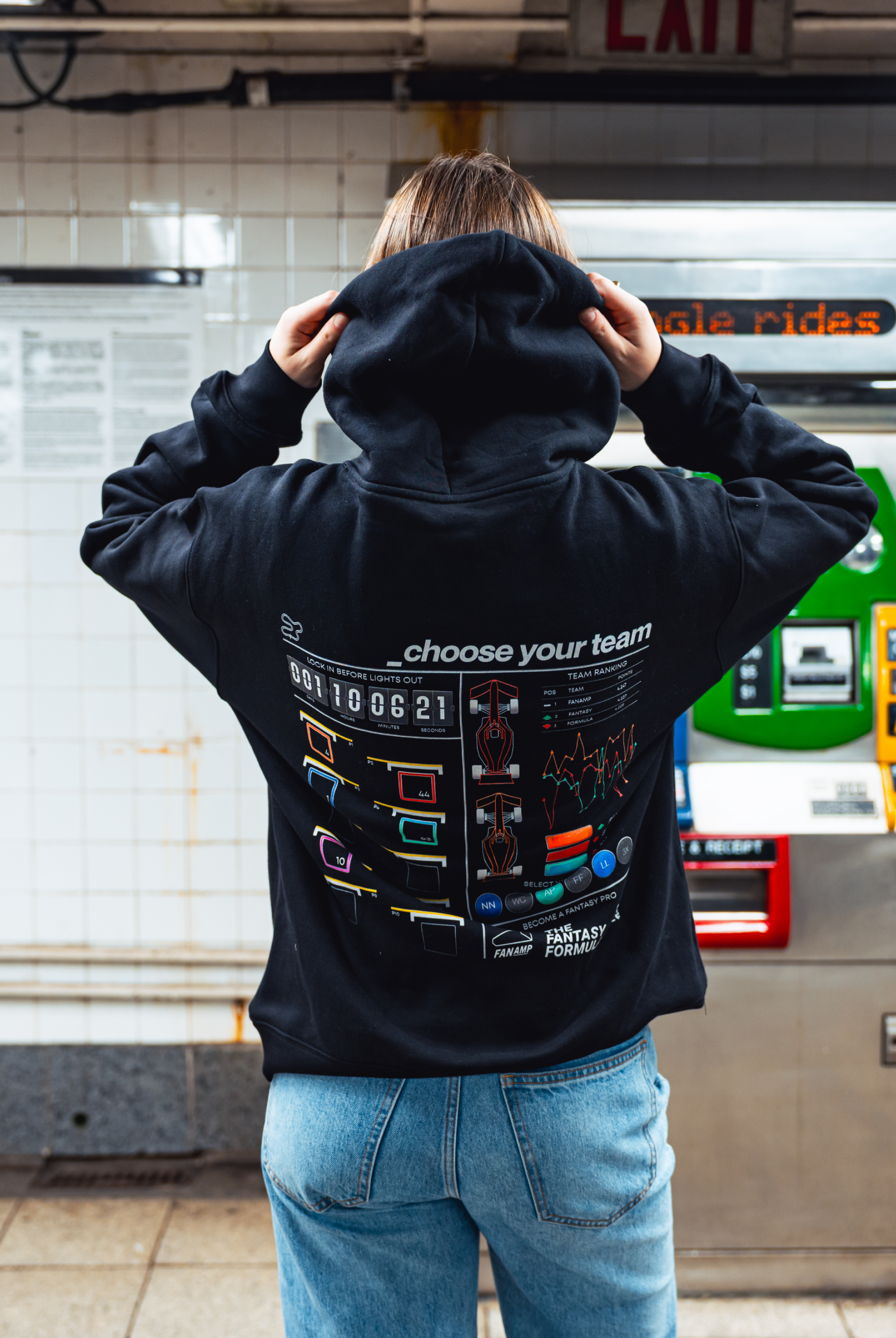 Model in NYC subway showing the back of the Black Fantasy Strategist hoodie