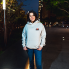 Model in NYC showing the front of the Bone Make The Pass hoodie