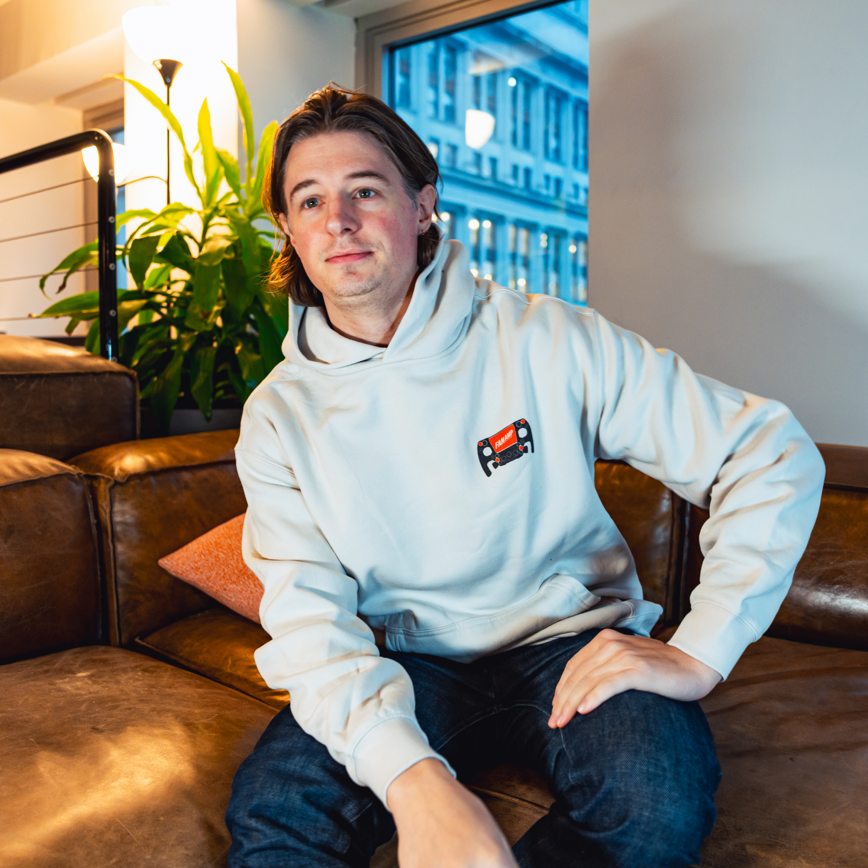 Model in NYC office showing the front of the Bone Make The Pass hoodie