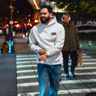 Model in NYC showing the front of the Bone Make The Pass hoodie
