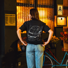 Model in NYC showing the back of the faded black Safety First t-shirt