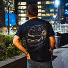 Model in NYC showing the black of the navy Safety First t-shirt