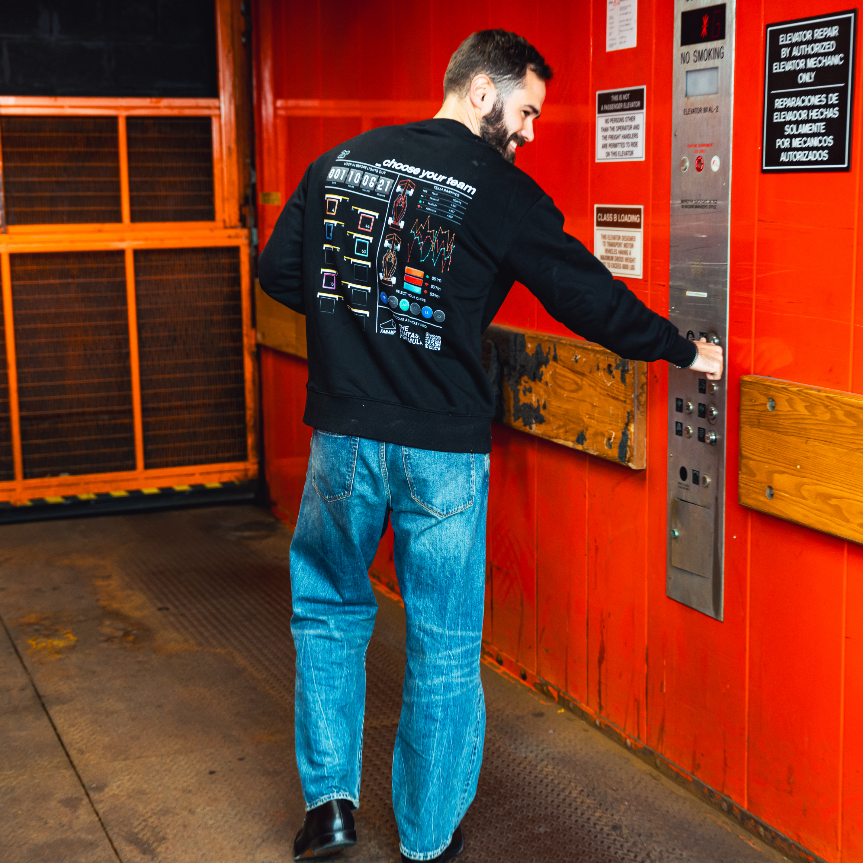 Model in NYC showing the back of the black Fantasy Strategist crewneck