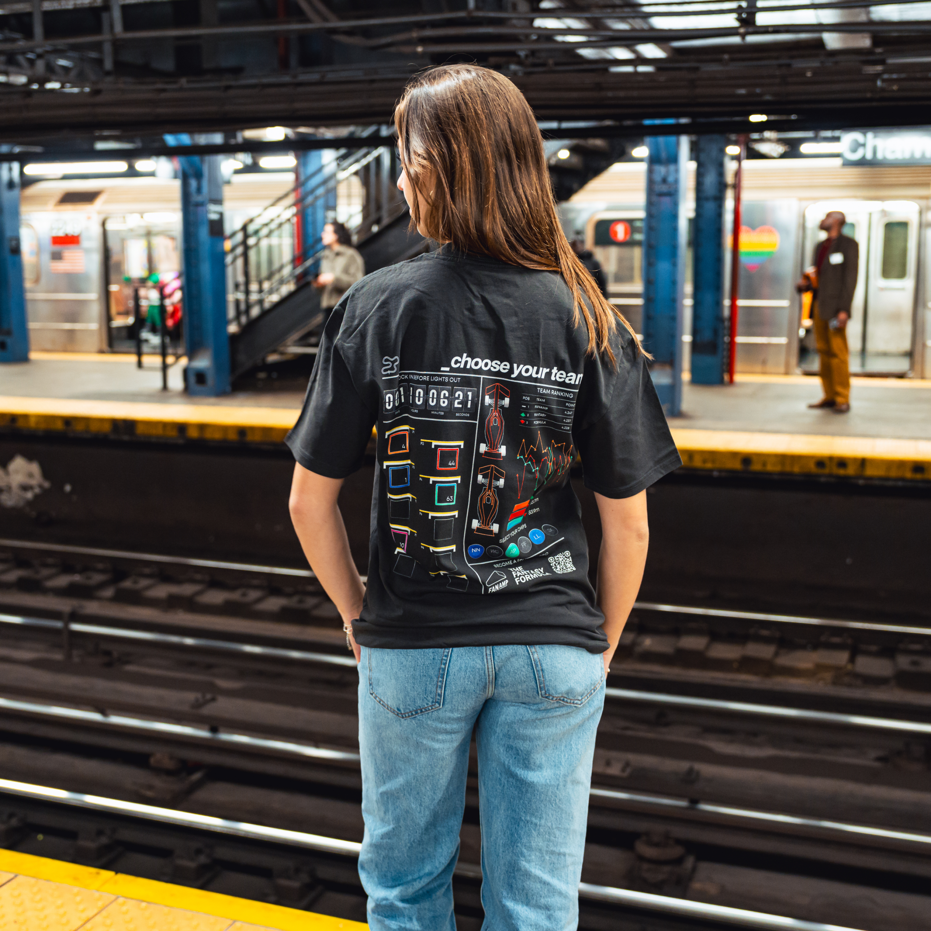Model in NYC subway showing the back of the Faded Coal Fantasy Strategist t-shirt