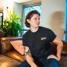 Model in NYC office showing the front of the Faded Coal Fantasy Strategist t-shirt
