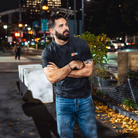 Model in NYC showing the front of the Faded Coal Fantasy Strategist t-shirt