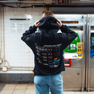 Model in NYC subway showing the back of the Black Fantasy Strategist hoodie