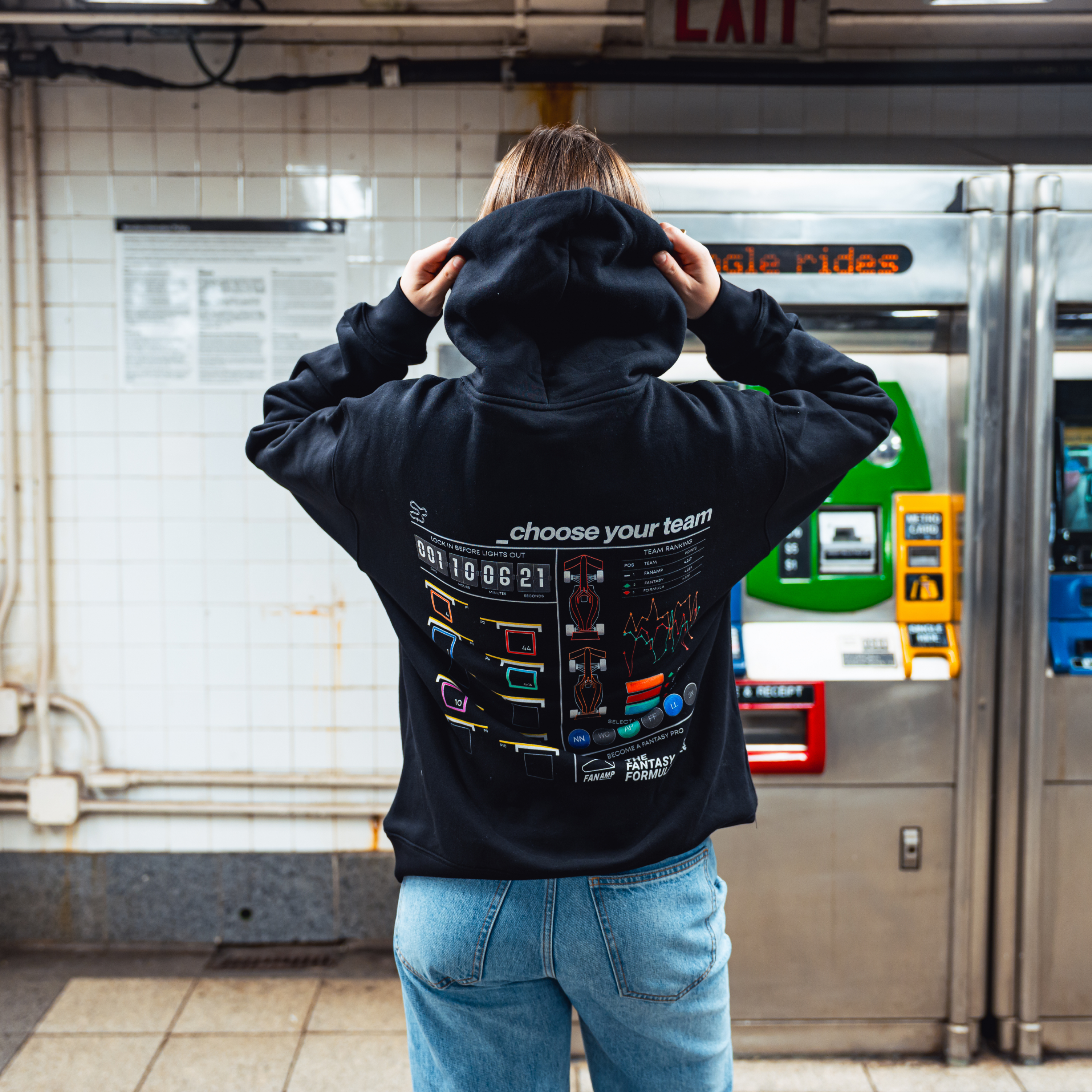 Model in NYC subway showing the back of the Black Fantasy Strategist hoodie